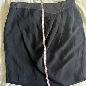 100% silk wrap skirt with pockets, pleats, and a tulip hem